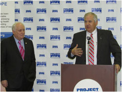 Inova CEO Knox Singleton (right) shares the story of more than 14,000 Inova employees who recently raised $120,000 to support Project HOPE's relief efforts in the Philippines in response to the devastation caused by Typhoon Haiyan. Project HOPE President and CEO Dr. John P. Howe looks on.