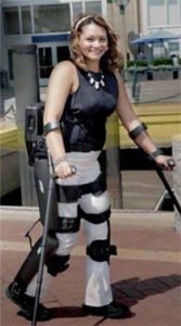 a young woman walking with the aid of ReWalk exoskeleton