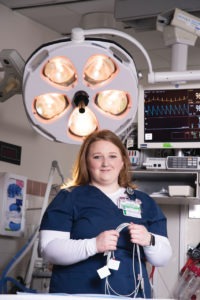 photo of nurse Courtney Caton holding equipment in the Emergency Room