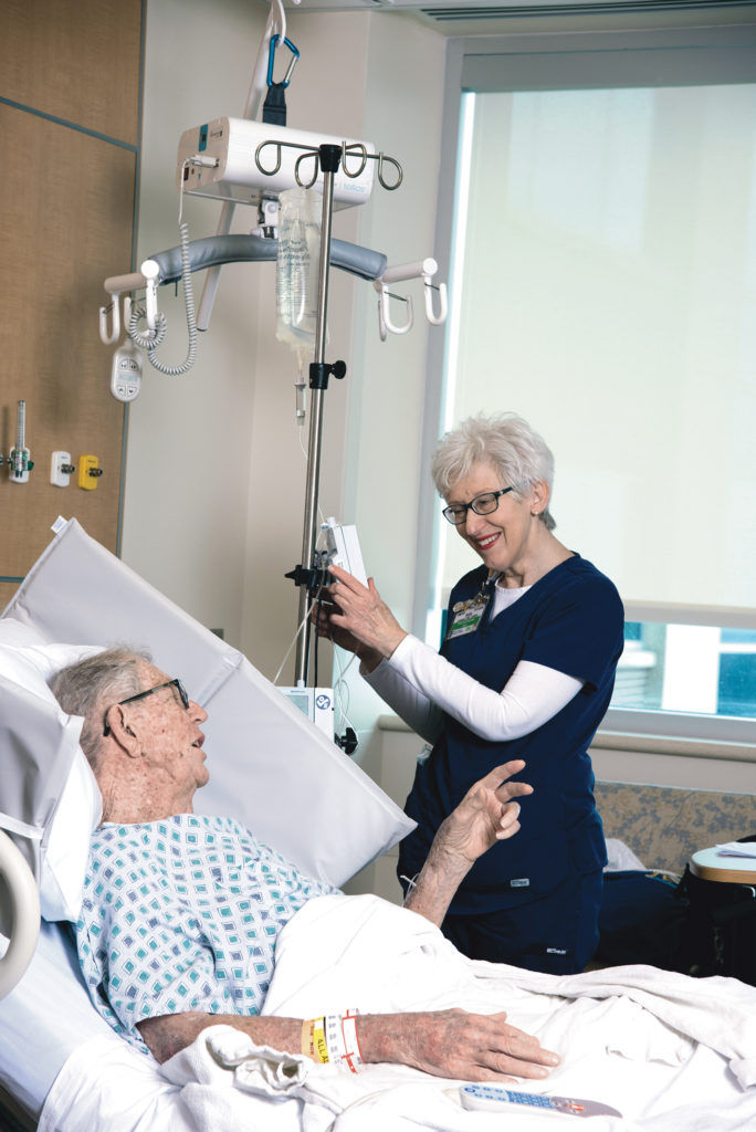 photo of nurse Sally Jewart caring for a patient