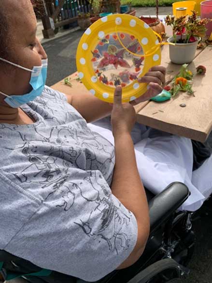 patient displaying a craft project