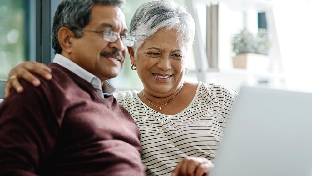 older couple looking at a laptop